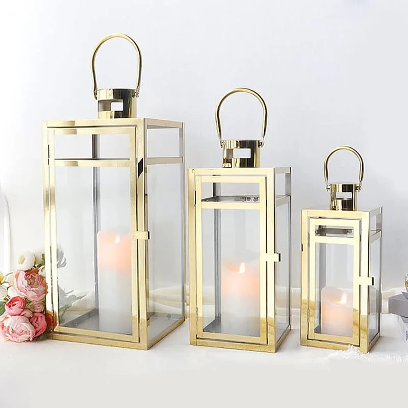 TRIROCKS Set de 3 Faroles de Acero Inoxidable 48, 38, 30 cm Altos, Soportes de Vela con Vidrio Transparente para Sala, Fiestas, Eventos, Interior y Exterior (Dorado) — Cena a la luz de velas