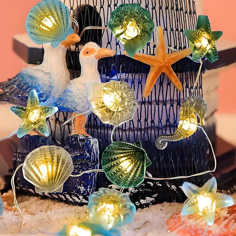 Visita la tienda de YATOSEEN Cadena de Luces LED Con Tema de Vida Marina, 2M 20LED Súper Divertidas, Caballito De Mar, Estrella De Mar, Concha, Caparazón - Control Remoto, Batería O USB — Luces Navidad